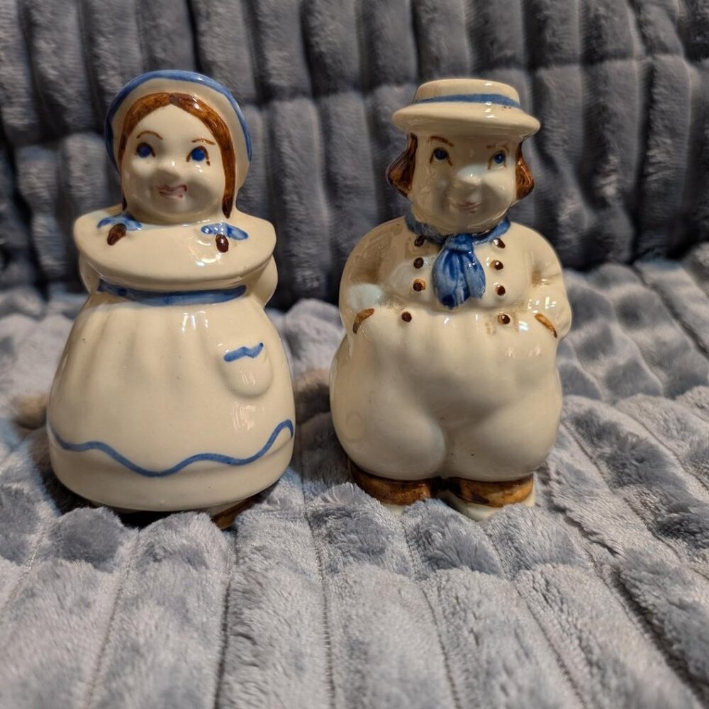 Ceramic salt and pepper shakers depicting Dutch boy and girl figures